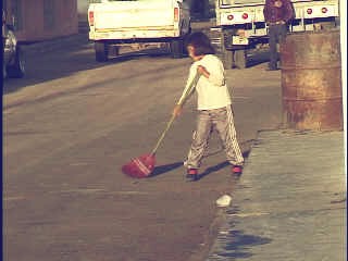 On my way back to the hotel, I saw a young girl doing her chores early in the morning